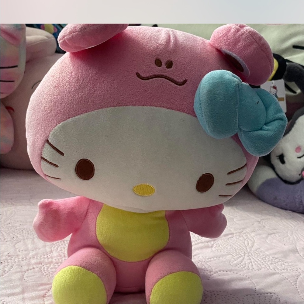 Pink and Blue Plush Stuffed Animal with Round Head and Bow